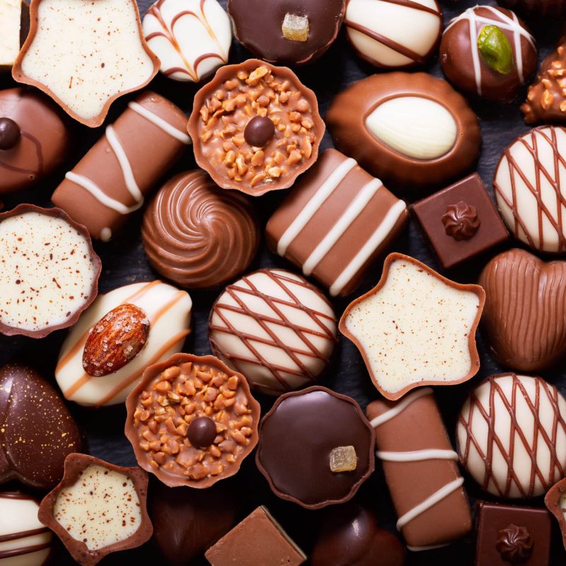 chocolate candies as background, top view